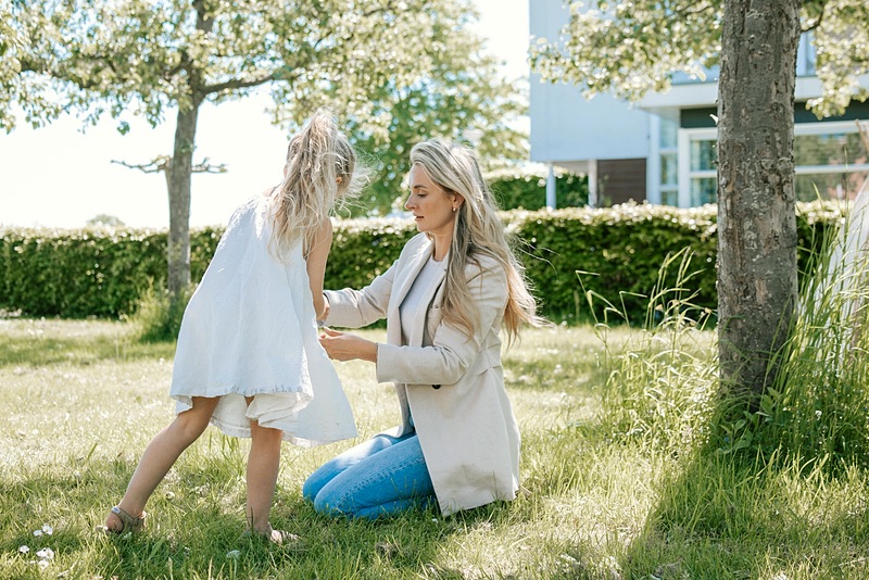 Nanny playing with a girl in the garden