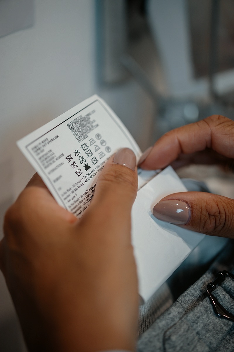 Care label being read while sorting the laundry