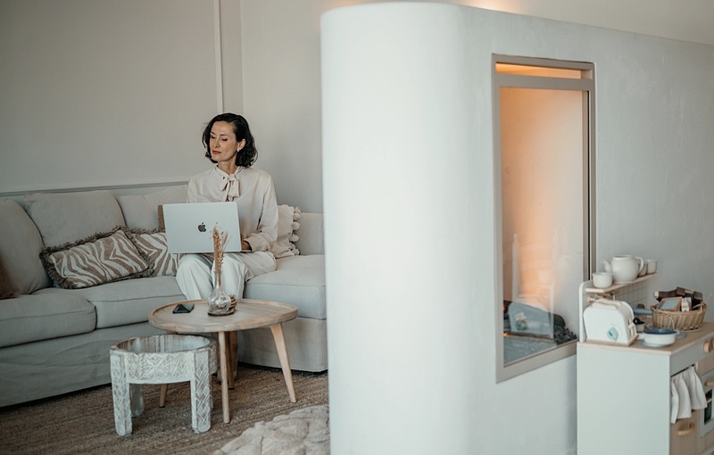 Working from home with a laptop on the sofa