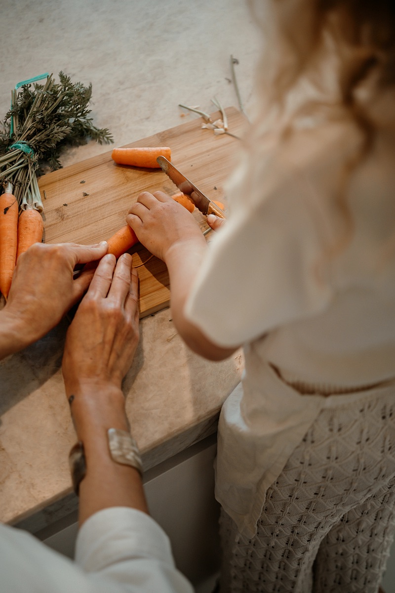 Carrots being cut on the counter
